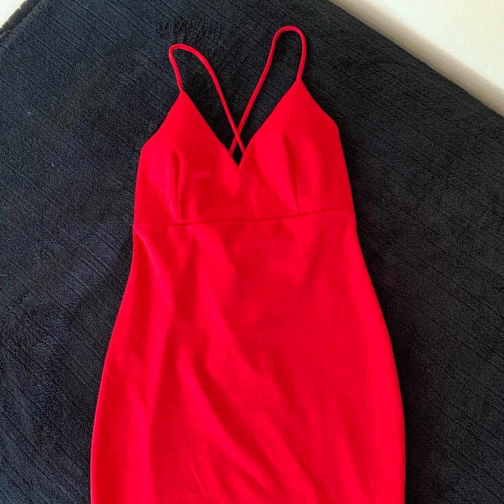 Red dress with cross spaghetti strap.